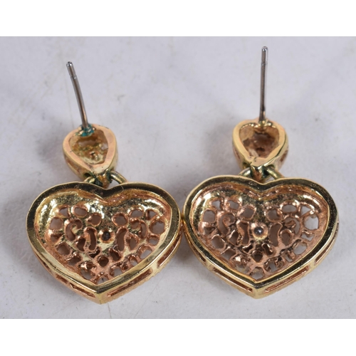 1485 - A PAIR OF YELLOW METAL HEART SHAPED EARRINGS. 4 grams. 2 cm x 1.5 cm.