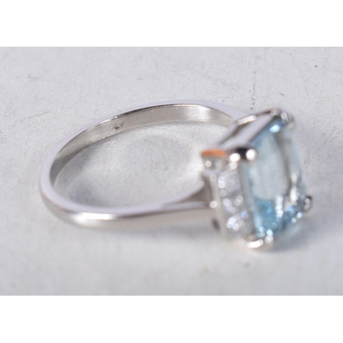 1544 - An Art Deco Platinum, Diamond and Aquamarine Ring. Indistinct marks, Size N, weight 4.4g