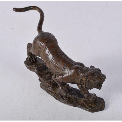 1565 - A Japanese Bronze Tiger Prowling on a Rocky Outcrop. 11.6cm x 8cm x 2.5cm, weight 439g