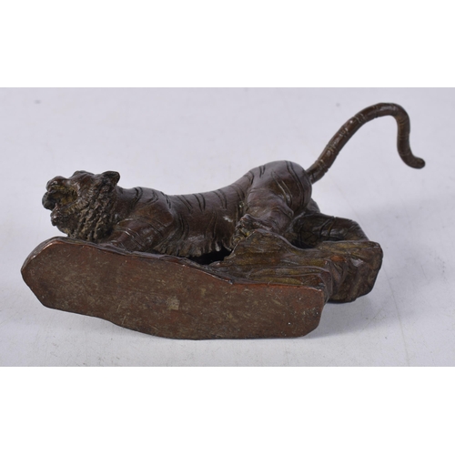 1565 - A Japanese Bronze Tiger Prowling on a Rocky Outcrop. 11.6cm x 8cm x 2.5cm, weight 439g