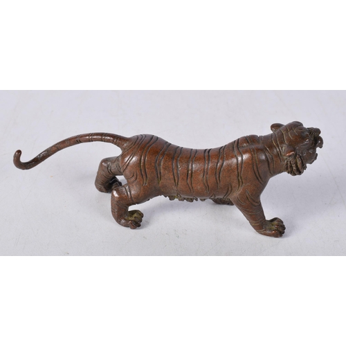 1566 - A Japanese Bronze Prowling Tiger. 13.5cm x 4.8cm x 3.3cm, weight 297.1g