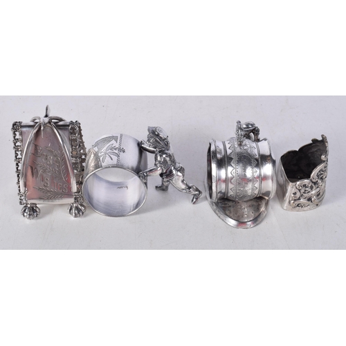 1567 - Four Novelty Silver Plated Napkin Rings. Largest 8.7cm x 4.8cm x 6.1cm (4)