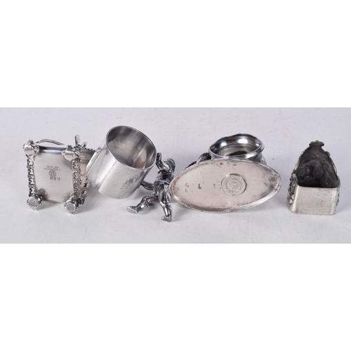 1567 - Four Novelty Silver Plated Napkin Rings. Largest 8.7cm x 4.8cm x 6.1cm (4)