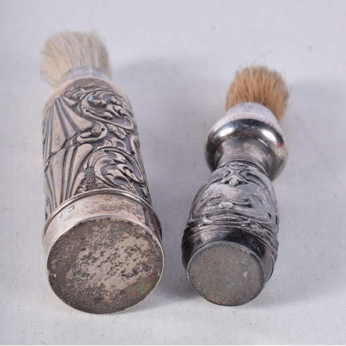 1568 - A Heavily Embossed Silver Shaving Brush together with another. 14 cm x 3.1cm, total weight 140.6g (2... 