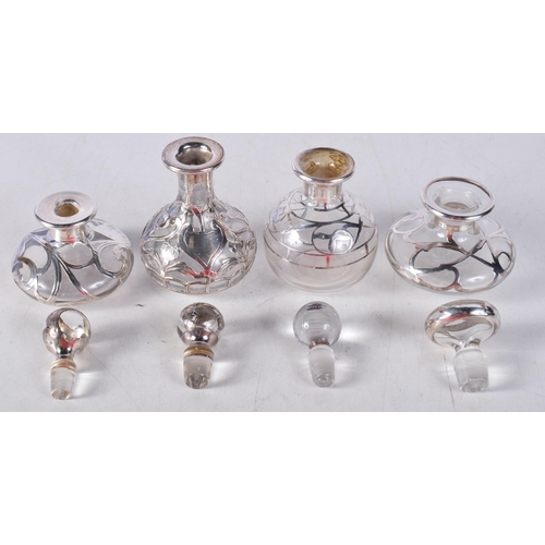 1575 - Four Silver Overlaid Glass Scent Bottles. Various marks, largest 9cm x 5.3cm (4)