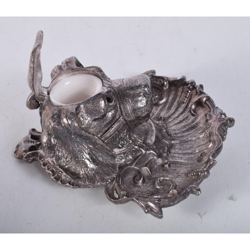 1604 - AN ANTIQUE SILVER PLATED ENAMELLED EYED SPANIEL INKWELL. 15 cm x 12 cm.