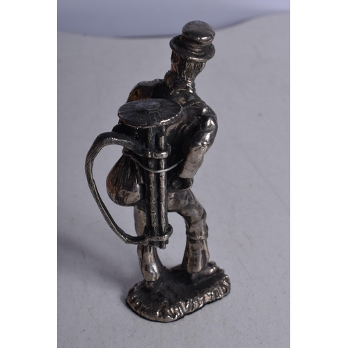 1605 - AN ANTIQUE WHITE METAL NOVELTY MUSICIAN. 226 grams. 10 cm high.