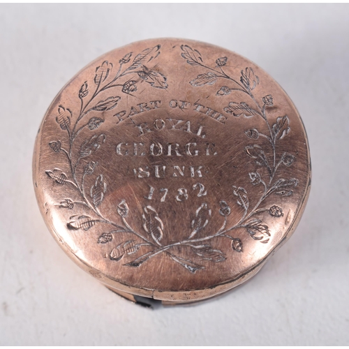 1648 - AN ANTIQUE YELLOW METAL LID inscribed 'Part of the Royal George Sunk 1782'. 6.5 grams. 2.25cm wide.