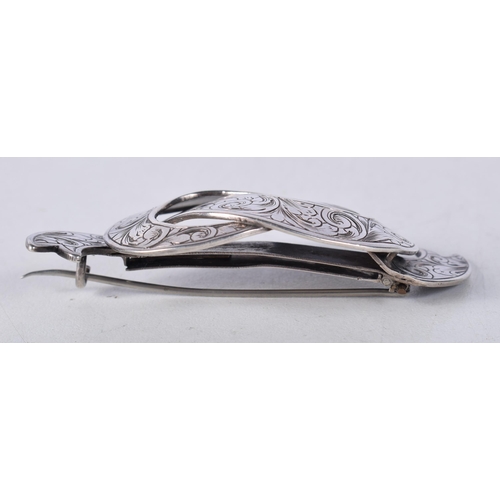 1650 - AN ANTIQUE SILVER BROOCH. 18.9 grams. 7.25cm x 3.25cm.