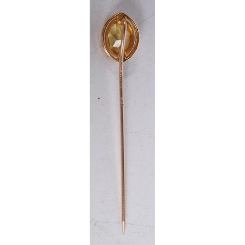 1657 - AN ANTIQUE 10CT GOLD PIN. 1.6 grams. 5.75 cm long.