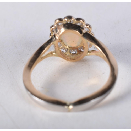 1658 - AN ANTIQUE GOLD DIAMOND AND OPAL RING. L. 3.2 grams.