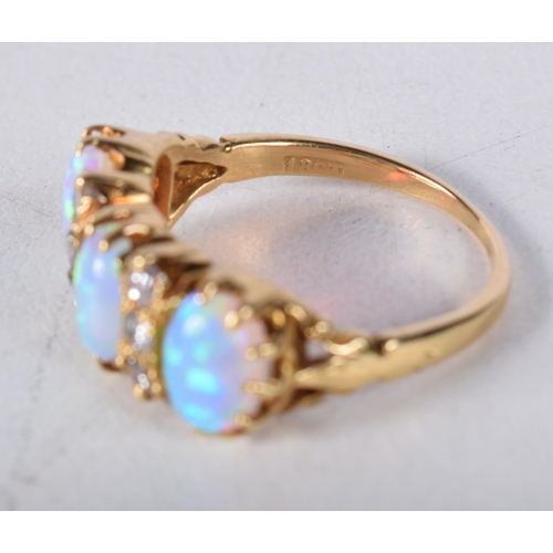 1661 - AN 18CT GOLD DIAMOND AND OPAL RING. M. 4.5 grams.