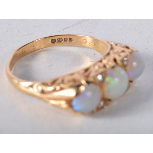 1668 - AN 18CT GOLD OPAL AND DIAMOND RING. P. 6.1 grams.