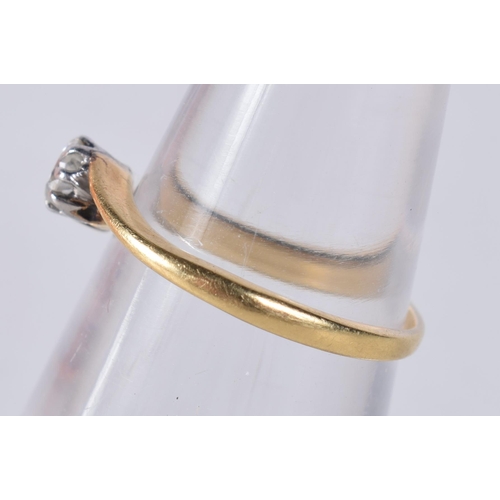 1677 - A YELLOW METAL AND DIAMOND RING. H. 1.4 grams.