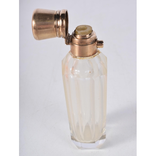 1678 - AN 18CT GOLD AND GLASS SCENT BOTTLE. 78 grams. 9.5 cm x 3.5 cm.