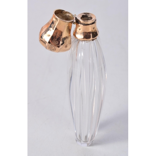 1679 - AN 18CT GOLD AND GLASS SCENT BOTTLE. 60 grams. 10.25cm x 3.75 cm.