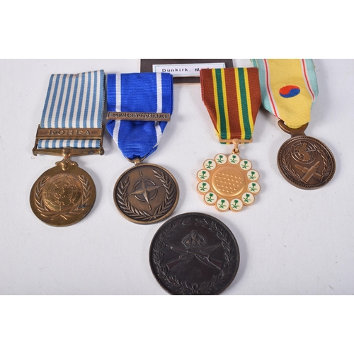 1684 - A Collection of Medals includes: NATO MEDAL WITH CLASP; FORMER YUGOSLAVIA FULL-SIZE REPLICA MEDAL. Z... 