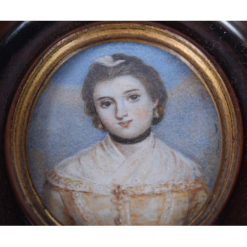 1702 - A 19TH CENTURY WATERCOLOUR PORTRAIT OF A FEMALE. 10 cm x 9 cm.