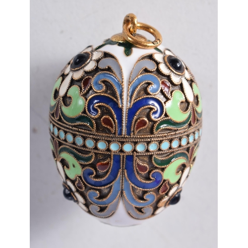 1741 - A Continental Silver Gilt and Enamel Egg Pendant. Stamped 84. 2.6cm x 1.2cm, weight 6.6g