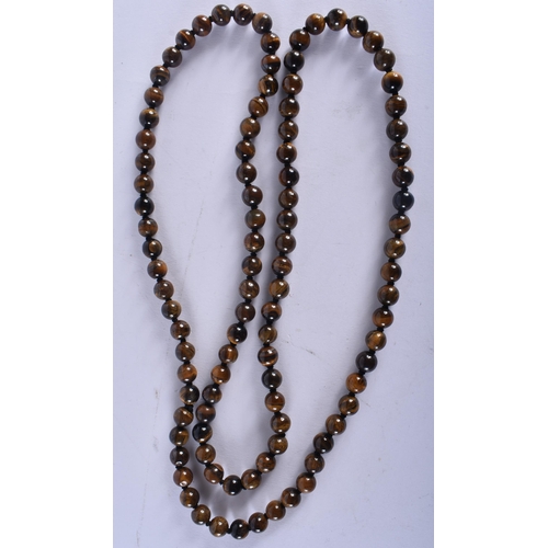 2689 - A CHINESE TIGERS EYE NECKLACE 20th Century. 84 grams. 92 cm long.