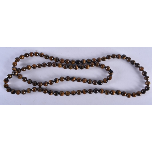 2689 - A CHINESE TIGERS EYE NECKLACE 20th Century. 84 grams. 92 cm long.