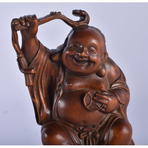 2230 - A 19TH CENTURY JAPANESE MEIJI PERIOD CARVED WOOD OKIMONO modelled as a male seated upon a spotted to... 