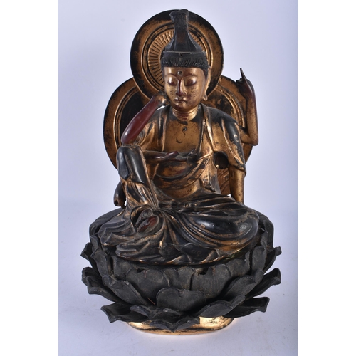 2239 - AN UNUSUAL 18TH CENTURY JAPANAESE EDO PERIOD GOLD LACQUERED WOOD FIGURE OF A BUDDHA modelled upon a ... 