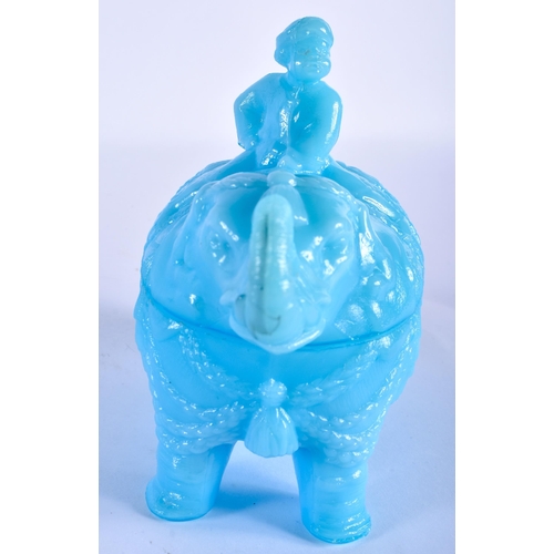 765 - A RARE VALLERYSTHAL PRESSED BLUE GLASS BOX AND COVER formed as a seated male upon an elephant. 18 cm... 