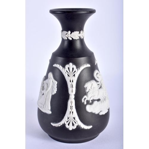 766 - A WEDGWOOD BLACK BASALT CLASSICAL VASE. 12 cm high.