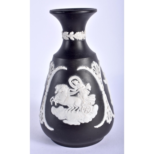 766 - A WEDGWOOD BLACK BASALT CLASSICAL VASE. 12 cm high.