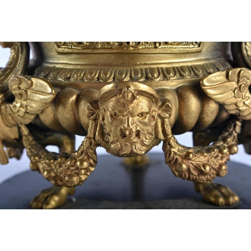 767 - A FINE 19TH CENTURY EUROPEAN GILT BRONZE INKWELL AND COVER formed with winged birds and mask heads. ... 