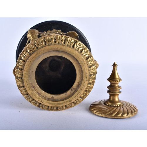 767 - A FINE 19TH CENTURY EUROPEAN GILT BRONZE INKWELL AND COVER formed with winged birds and mask heads. ... 