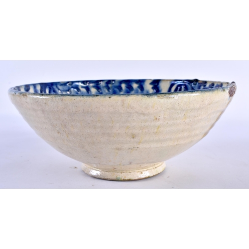 775 - A 19TH CENTURY PERSIAN MIDDLE EASTERN POTTERY BOWL with unusual raised floral sprig decoration. 22 c... 