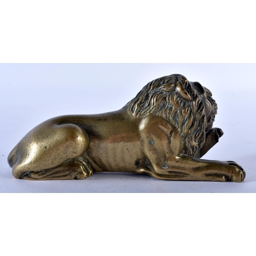 777 - A REGENCY BRONZE FIGURE OF A RECUMBANT LION. 12 cm x 6 cm.