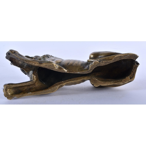 777 - A REGENCY BRONZE FIGURE OF A RECUMBANT LION. 12 cm x 6 cm.