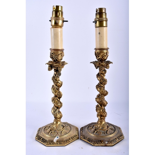 778 - A LOVELY PAIR OF 19TH CENTURY EUROPEAN BRONZE CANDLESTICK LAMPS overlaid with trailing vines and aca... 