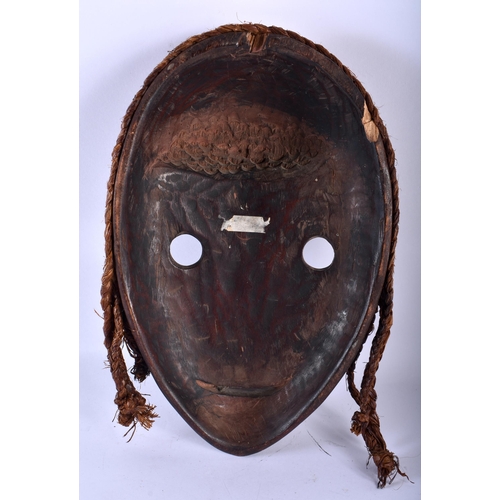 779 - AN AFRICAN TRIBAL CARVED WOOD MASK. 32 cm x 20 cm.