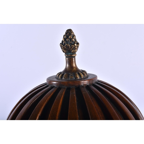 782 - AN ANTIQUE CARVED WOOD TREEN VASE AND COVER with gilt metal banding. 37 cm high.