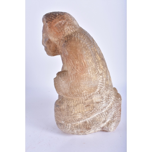 795 - AN UNUSUAL EARLY 20TH CENTURY NORTH AMERICAN INUIT CARVED STONE FIGURE modelled kneeling. 24 cm x 12... 