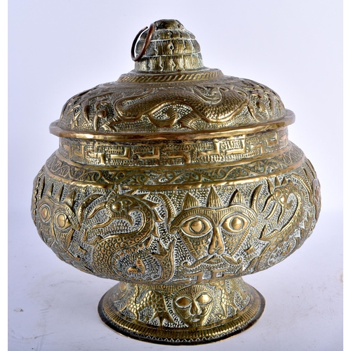 796 - A 19TH CENTURY INDIAN EMBOSSED BRASS VASE AND COVER decorated with Hindu figures and mythical beasts... 