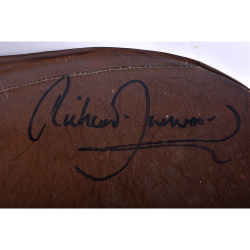 801 - HORSE RACING INTEREST A Signed Richard Dunwoody leather saddle. 50 cm x 50 cm. Note: Dunwoody's race... 