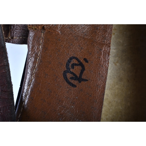 801 - HORSE RACING INTEREST A Signed Richard Dunwoody leather saddle. 50 cm x 50 cm. Note: Dunwoody's race... 