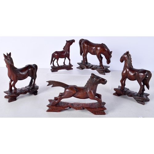 3510 - A collection of Chinese carved hardwood horses largest 12 x 10 cm.(5).