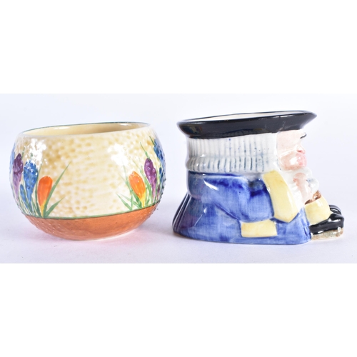 100 - A CLARICE CLIFF CROCUS BOWL together with a Clarice Cliff character jug. Largest 7 cm wide. (2)