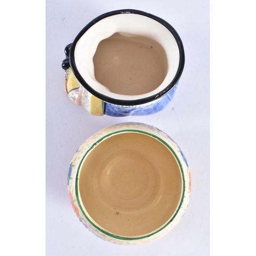 100 - A CLARICE CLIFF CROCUS BOWL together with a Clarice Cliff character jug. Largest 7 cm wide. (2)