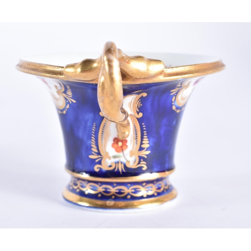 104 - A RARE EARLY 19TH CENTURY COALPORT PORCELAIN CUP AND SAUCER, with unusual dual serpent handle, paint... 