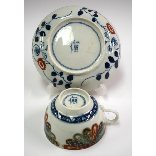 129 - 18th century Worcester tea up and saucer painted with Old Japan Fan pattern, Chinese character mark.... 