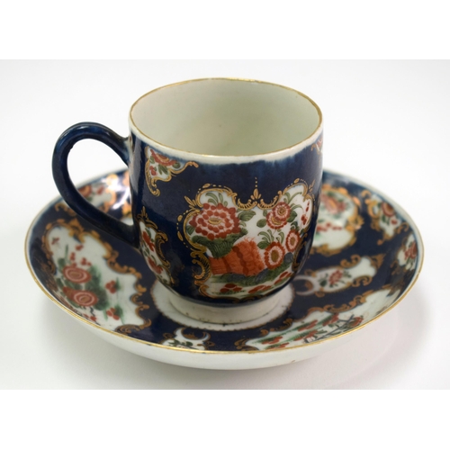 134 - 18th century Worcester coffee cup and saucer painted with kakiemon flowers in gilt panels on a blue ... 