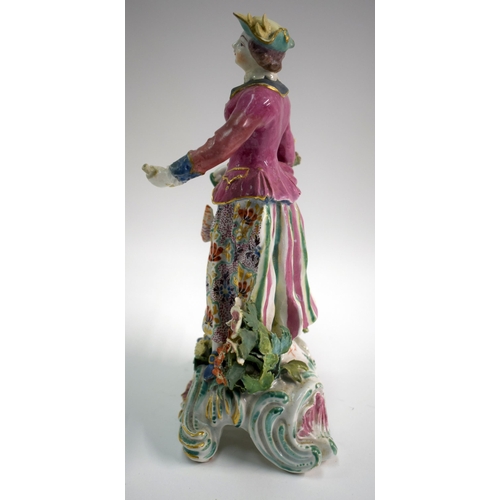 172 - 18th century Bow figure of a huntswoman holding a hare and a game bird in her right hand and a flask... 