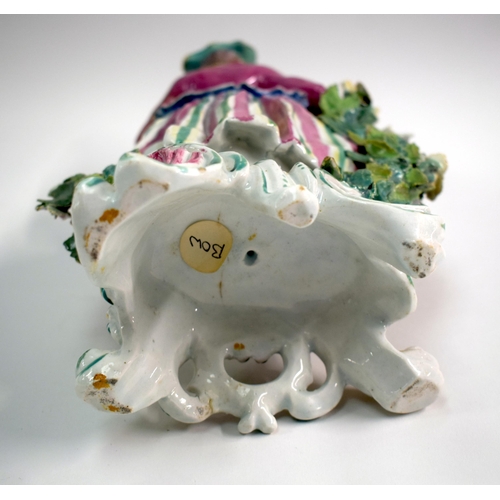 172 - 18th century Bow figure of a huntswoman holding a hare and a game bird in her right hand and a flask... 